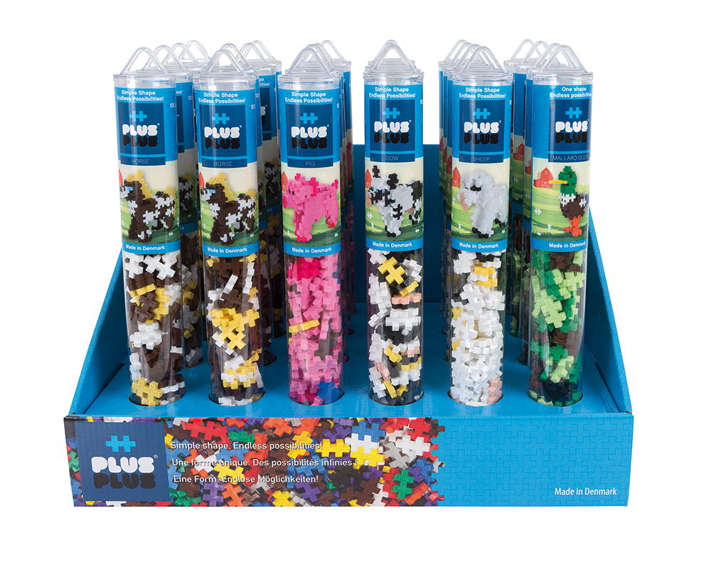 Display Plus-Plus Tuby Farma 24 sztuki ustawiony na ladzie sklepowej