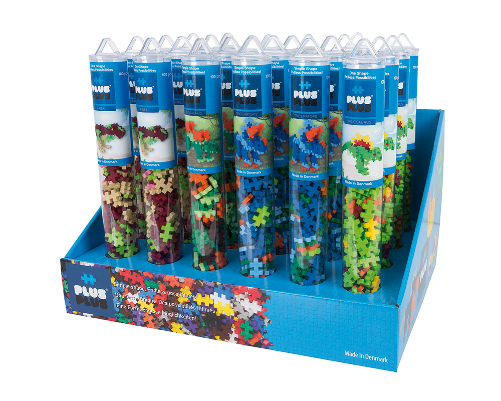 Zbliżenie na tuby Plus-Plus z dinozaurami pokazujące różne kolory i rodzaje klocków