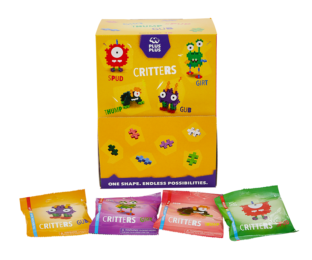 Display Plus-Plus Potworki z kolorowymi saszetkami na ladzie sklepowej