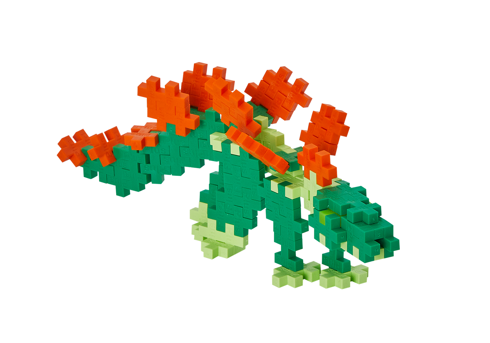 Zbliżenie na kolorowe klocki Plus-Plus Stegozaur wysypane z tuby